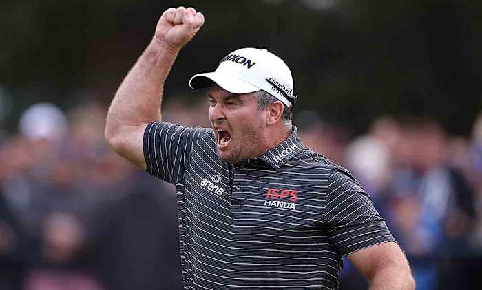 Ryan Fox of New Zealand celebrates as he holes the winning putt on the 18th green at the 2023 BMW PGA Championship.